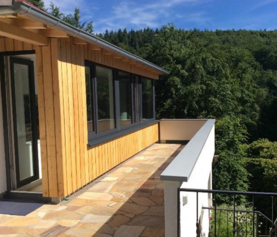 Terrace and timber facade of the extension